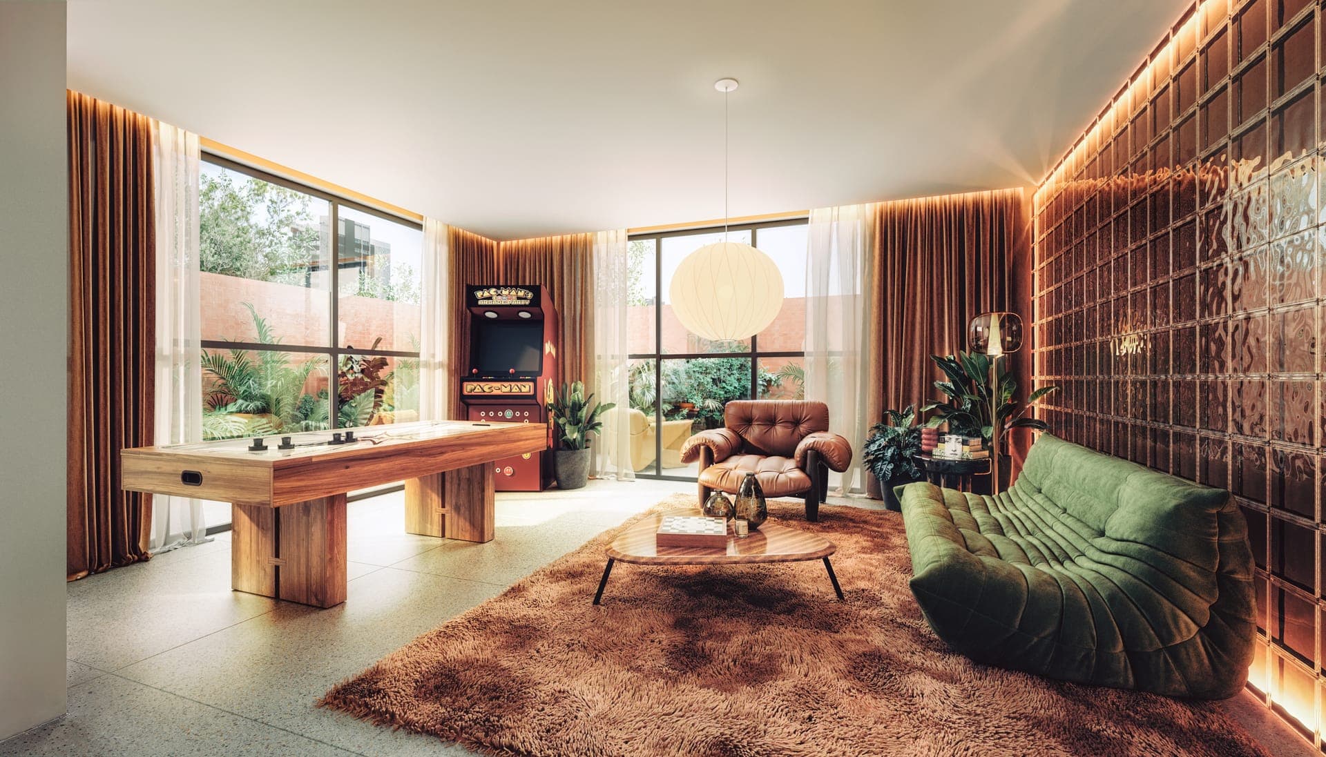 Coliving do Âmbar com sala de jogos e sofá verde