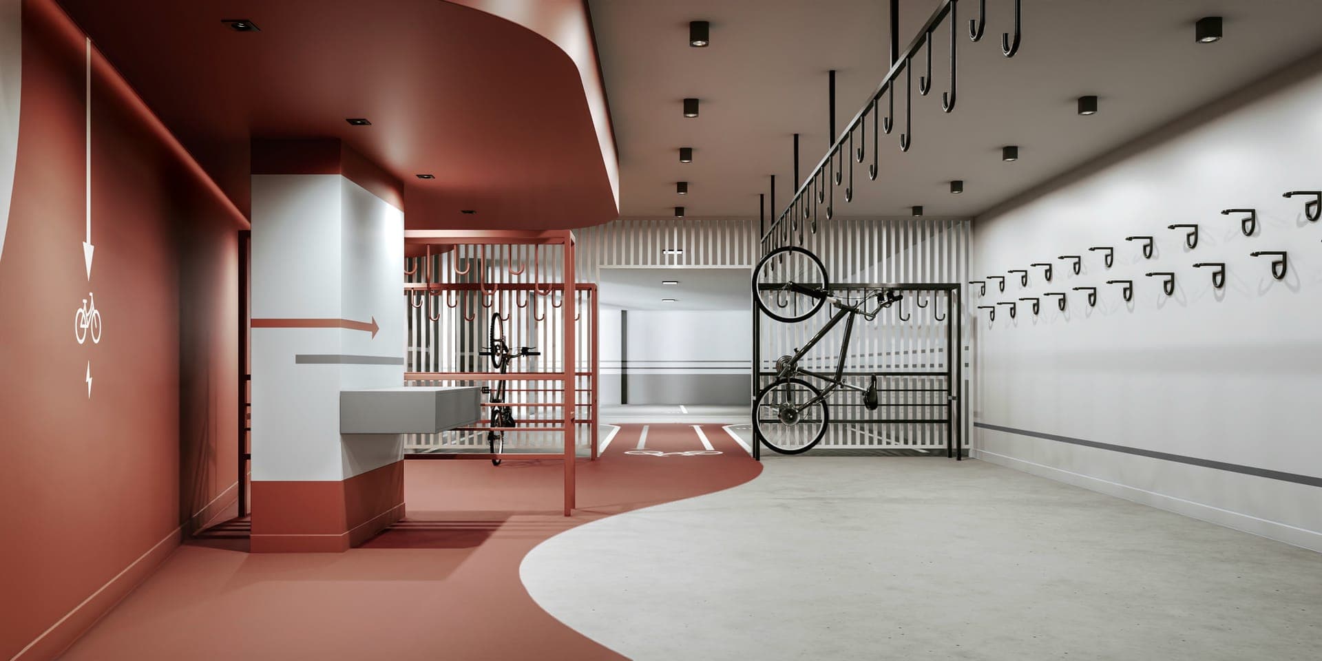 Bicicletário do Core Palácio com ganchos e piso vermelho