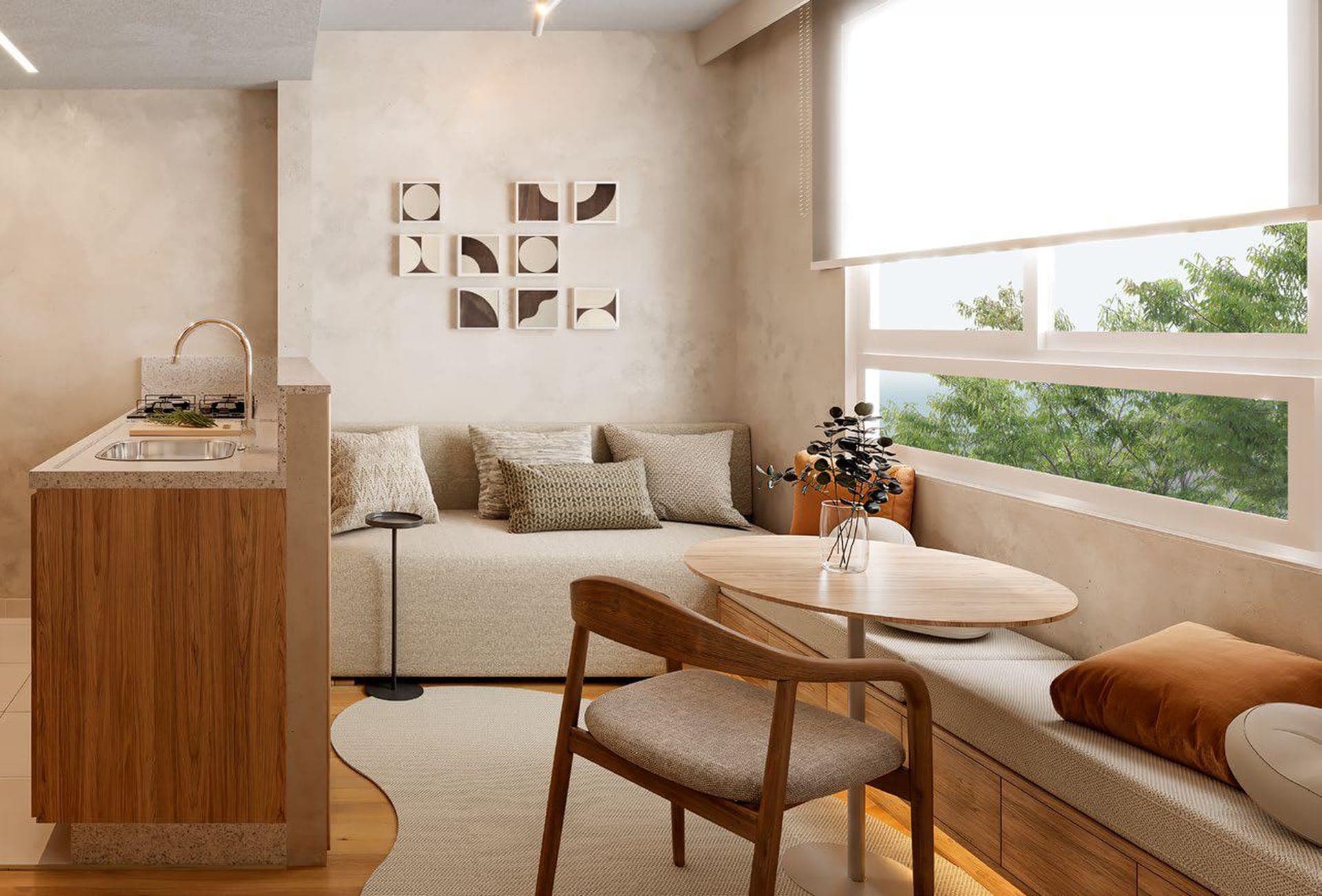 Sala decorada do Hauer 4You com sofá junto à janela e cozinha integrada
